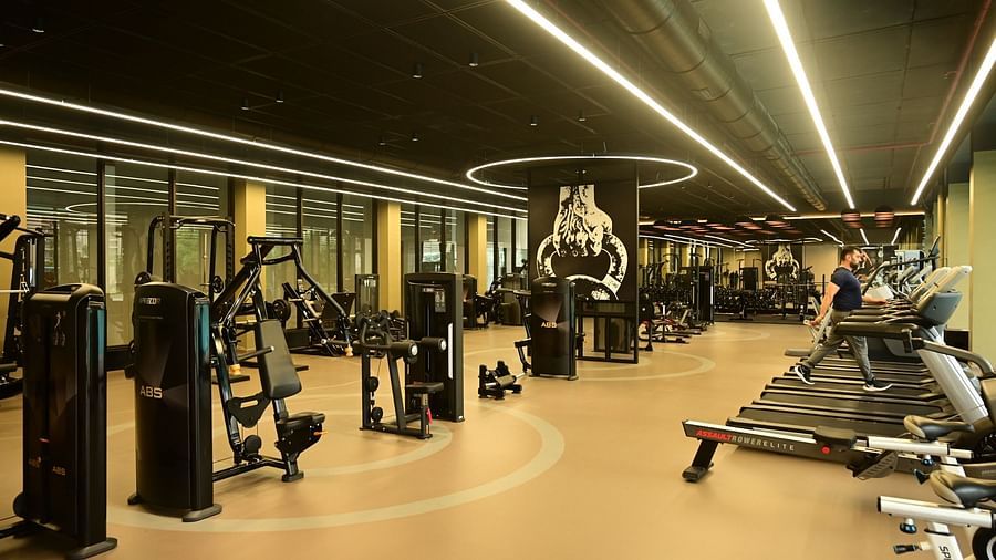 image of a well equipped gymnasium at club charholi, pune